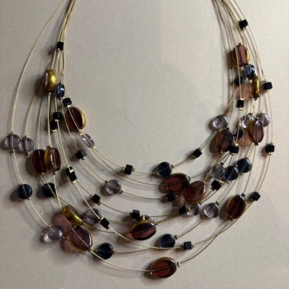multi-strand beaded necklace with a light, modern, and artistic design